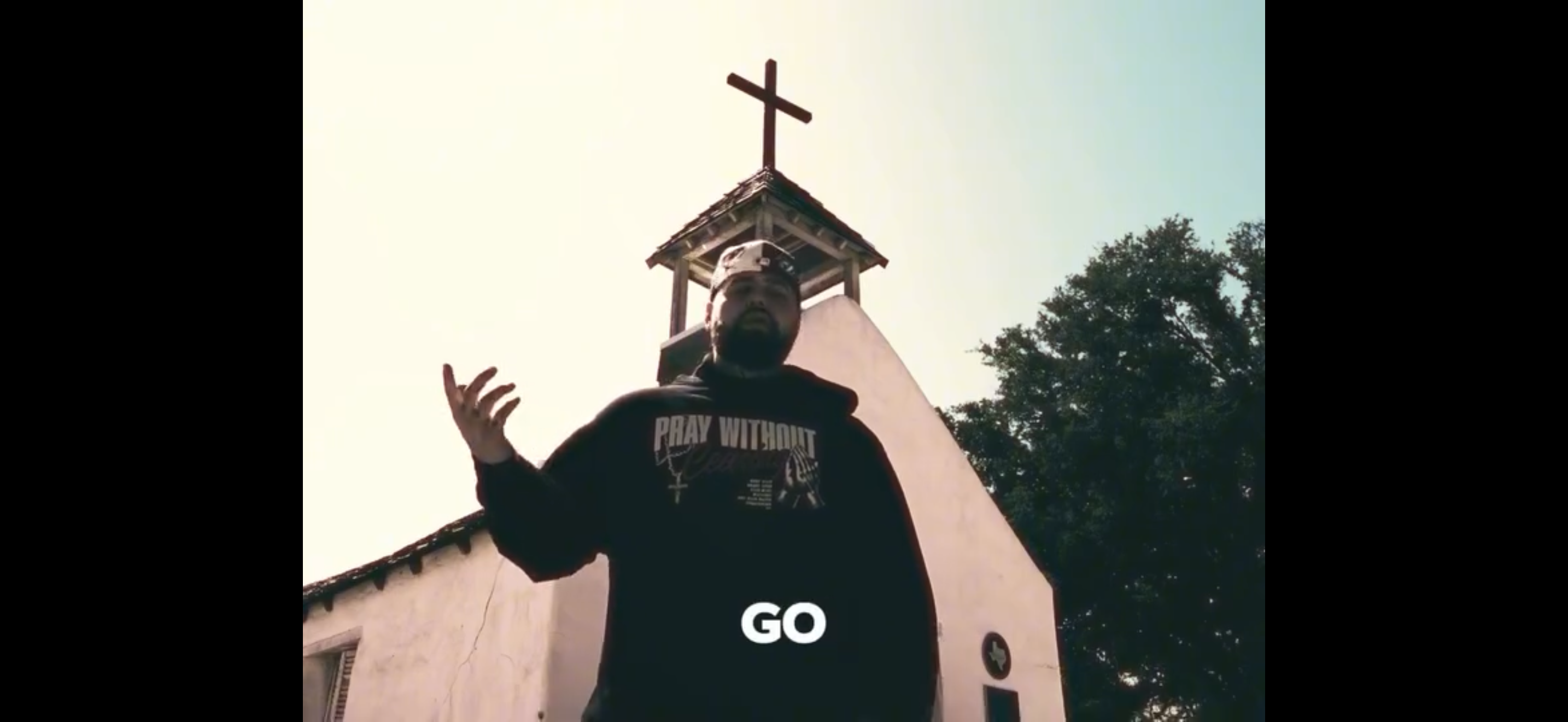 Ayomilly wearing 2 Crowns Pray Without Ceasing Hoodie in Kilimanjaro music video